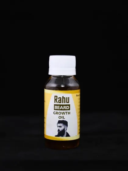 A clean shot of the Rahu Beard Growth Oil bottle. It's a specialized Ayurvedic formula designed to support facial hair growth and health.