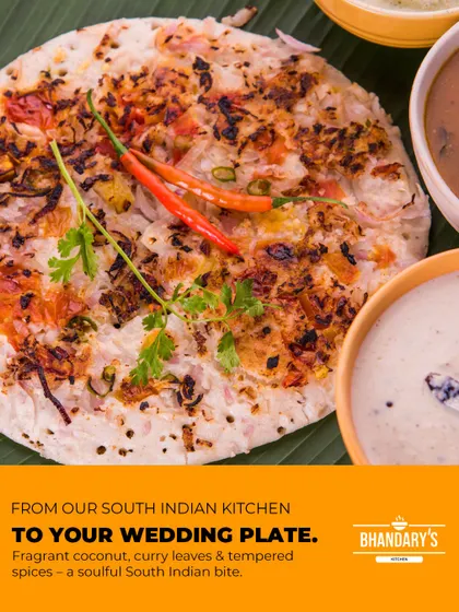From my South Indian kitchen to your wedding plate. This is a classic uttapam, topped with onions and chillies and served with fragrant coconut chutney and sambar, offering a soulful and authentic taste.