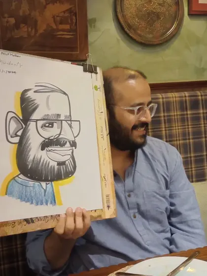 Another angle of the guest from image 275, showing his appreciation for the artwork.
