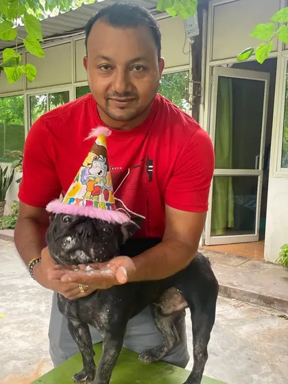 For me, these pets are like my own bachhe. I'm personally involved in their care every single day, and that includes celebrating their special moments. Here I am with Phil the French Bulldog on his birthday, making sure he feels all the love.