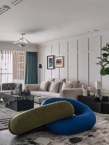 The living room of Frenchie Haus is a celebration of creativity and comfort, with unique furniture pieces that reflect the clients' personalities.