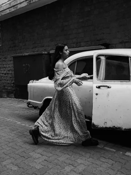 Another narrative moment from the vintage car series. The motion of her exiting the car creates a feeling of being caught in the middle of a story.