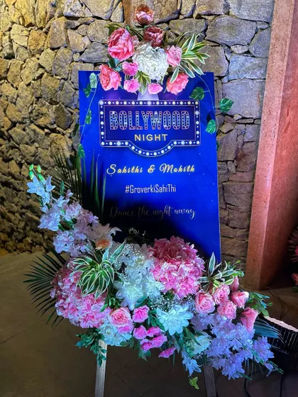 A "Bollywood Night" welcome board for a sangeet, setting the theme for a night of music and dance.