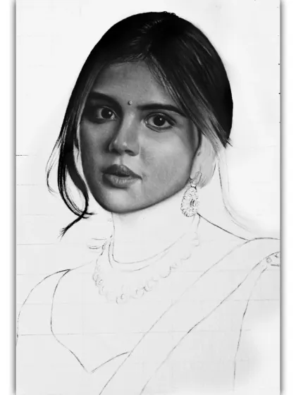 A duplicate of the progress shot where the face and hair of Kalyani Priyadarshan are nearly done, highlighting the stage before the clothing is detailed.