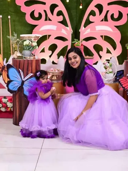 For a butterfly-themed birthday party, I designed these matching lavender outfits. The little one's dress even has its own set of wings.