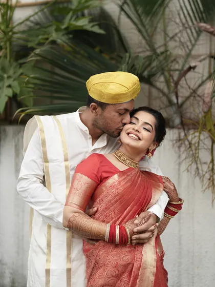 An adorable moment between the bride and groom. Her makeup is designed to be picture-perfect from every angle, capturing the love and happiness of the day.