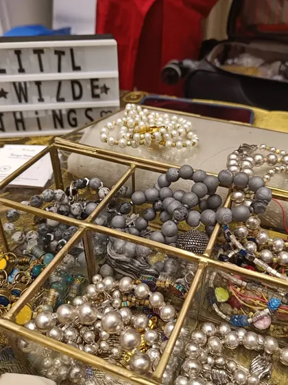 A beautiful display of handcrafted bracelets from 'Little Wilde Things', showcasing the kind of unique accessories visitors can discover.