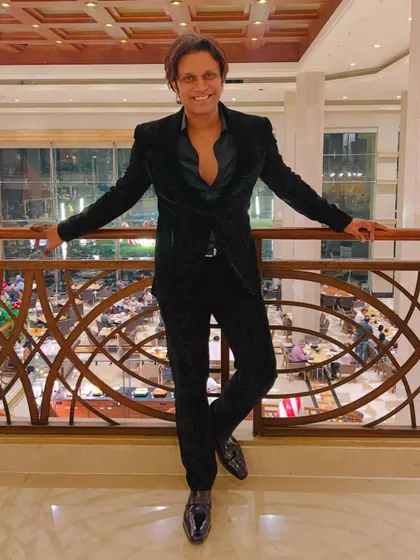 About last night. A classic all-black velvet suit for a sophisticated yet edgy look at a corporate gala.