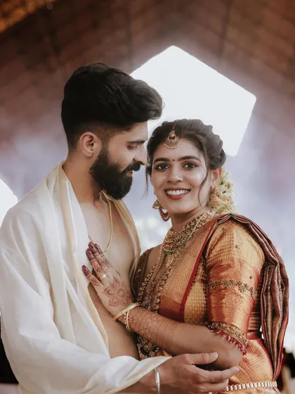 An intimate and warm portrait of a newly married couple, capturing their close bond.