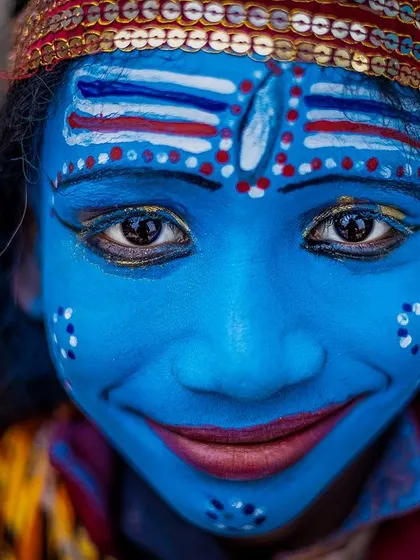 The innocent smile of a child dressed as Lord Shiva on the ghats of Banaras. It's a reminder of the divine spark I seek to find in every face I photograph.