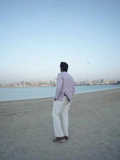 A moment of contemplation, looking out at the Dubai coastline. These quiet moments help me recharge for the high-energy events.
