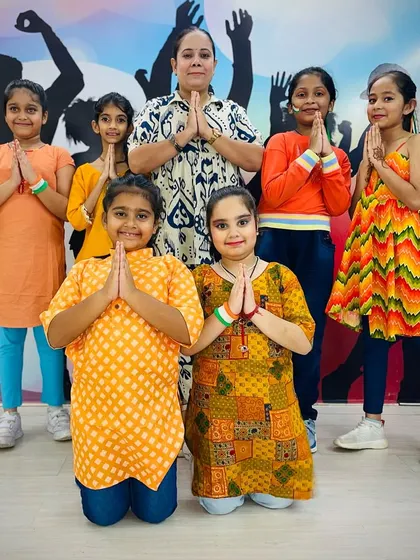 The full group of performers for our Independence Day event, posing with their instructor in a gesture of respect and unity.