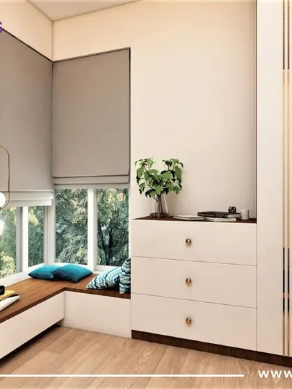 This bedroom in the Pune project features a cozy window seat and a beautiful blue woven headboard, creating a perfect corner for relaxation and reading.