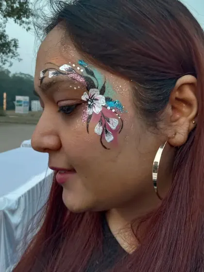 One of my more intricate floral pieces, with multiple flowers, leaves, and swirls in pink, white, and teal. This design is a true statement piece.