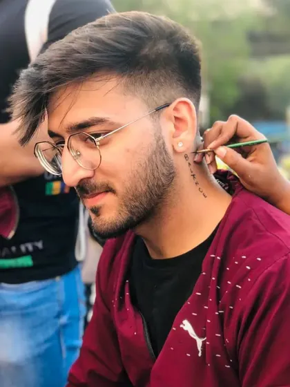 Painting the word "BALANCE" vertically down the neck. Text tattoos are a great way to express yourself.