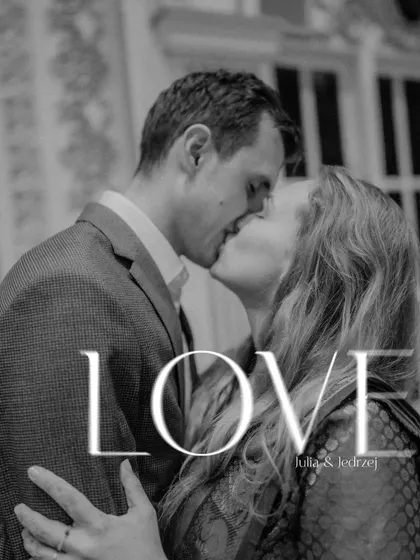 A black and white photo capturing a passionate kiss. The simple "LOVE" text overlay emphasizes the raw emotion of this beautiful, intimate moment.