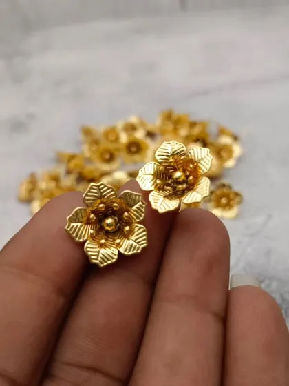 A duplicate image of the beautiful gold-plated pooja flowers.