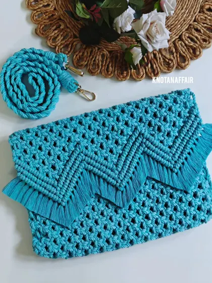 For a more elegant and chic look, I created this beautiful turquoise sling bag. It can be used as a clutch or a purse and shows the versatile side of macrame. The intricate knotting and fringe detail make it a statement piece for any occasion.