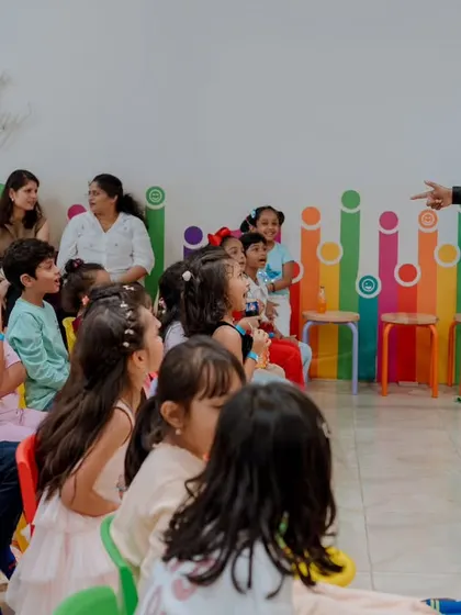 Interacting with the audience during a performance at a kids' event. I often move around and engage directly with the crowd to keep the energy high.