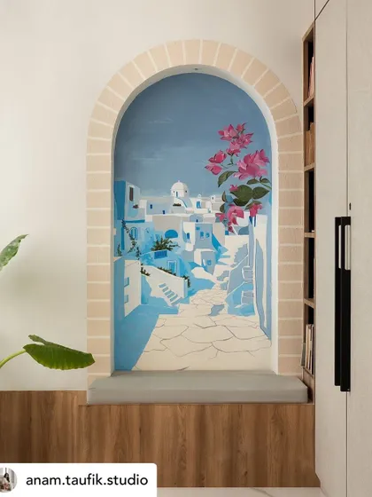 A small nook in a master bedroom becomes a window to Santorini. This scenic mural is designed to transport you, creating a personal seaside retreat and a serene escape within your own home.