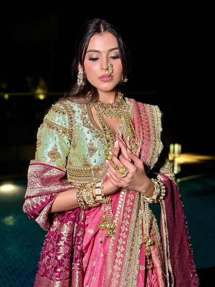 This look celebrates heritage with a contemporary soul, featuring soft glam makeup that complements the intricate embroidery of the ensemble.