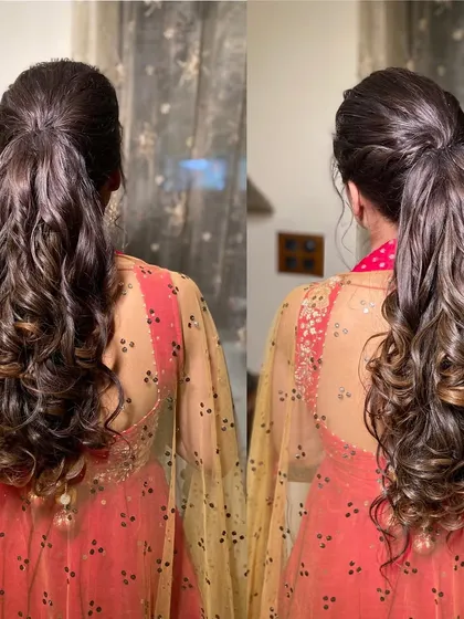 A clear back view of the high ponytail, highlighting the volume and beautiful curls.