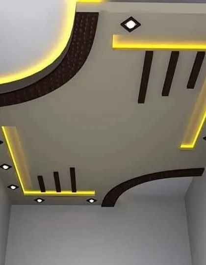 I love combining different textures. This design uses a dark, textured material in the corners to contrast with the smooth white POP and warm yellow lights.