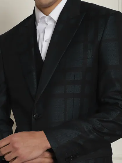 A detailed view of the checkered fabric on our dark formal suit, adding subtle visual interest.