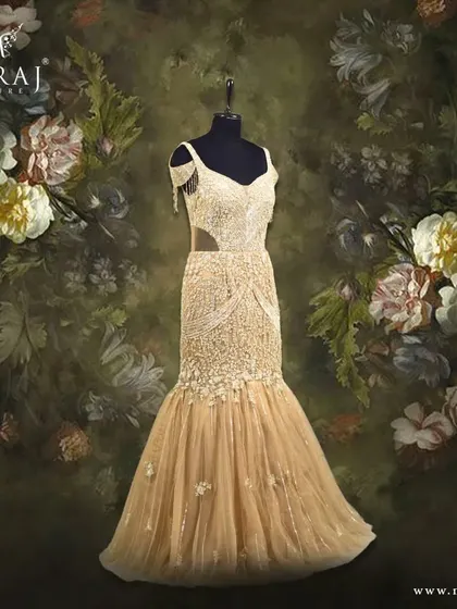 Capture the essence of luxury with this gilded gold mermaid gown, featuring an off-shoulder neckline and beautiful detailing.