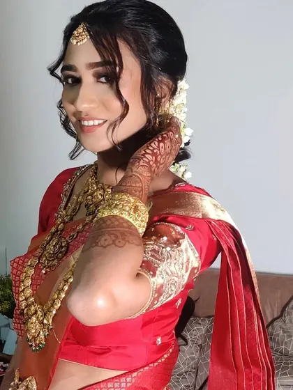 A happy, candid shot of Ankita, showcasing her radiant smile and beautiful bridal glow.