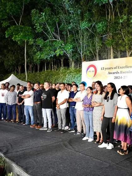 A wide shot of all the parents on stage, enjoying the celebration and being a part of the fun.