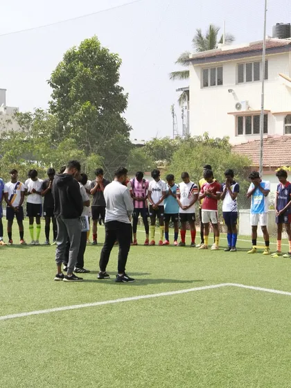 A moment of instruction before the trials begin. Our coaches lay out the plan, ensuring every player understands what is expected of them.