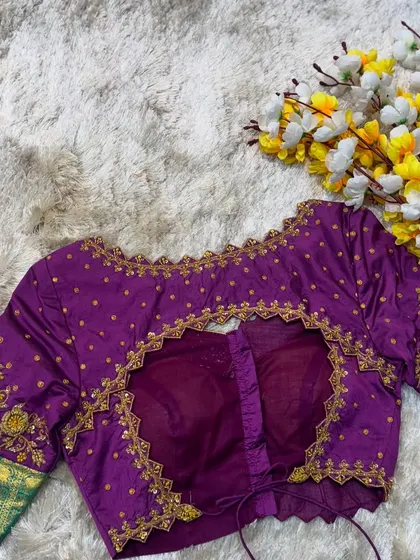 A full view of the purple and green blouse, a perfect example of a colorful yet elegant design.