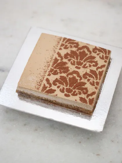 Here to wreck New Year resolutions is my most ordered cake of 2023! This square version of my boozy coffee cheesecake shows how a simple stencil can create a really elegant and beautiful design.
