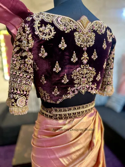 A closer look at the back of the velvet blouse, showcasing the rich texture and detailed craftsmanship.