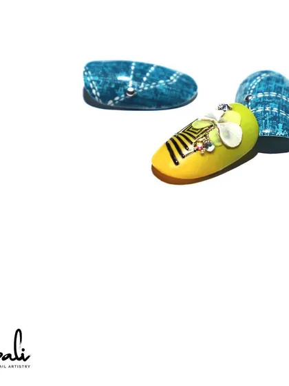A still shot of the 3D bow and jeans-effect nail art, a fun and creative mix of textures and styles.
