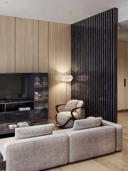 A modern living room interior with light wood paneling and a dark, integrated media unit. The focus is on clean lines and a balanced, contemporary color palette.