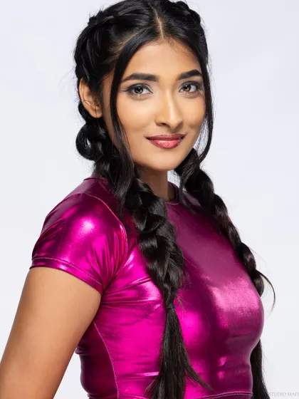 A close-up smiling portrait from the metallic pink shoot.