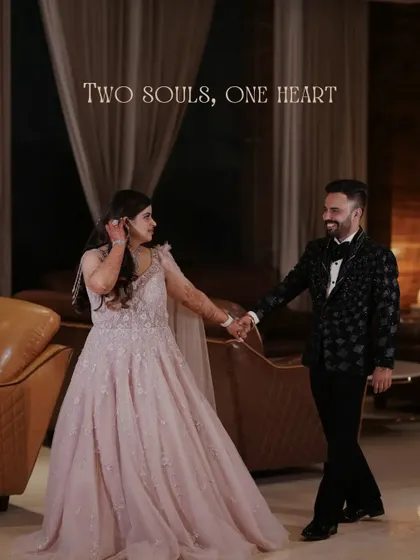 A candid shot of the couple walking hand in hand through their engagement party venue, sharing a happy moment.