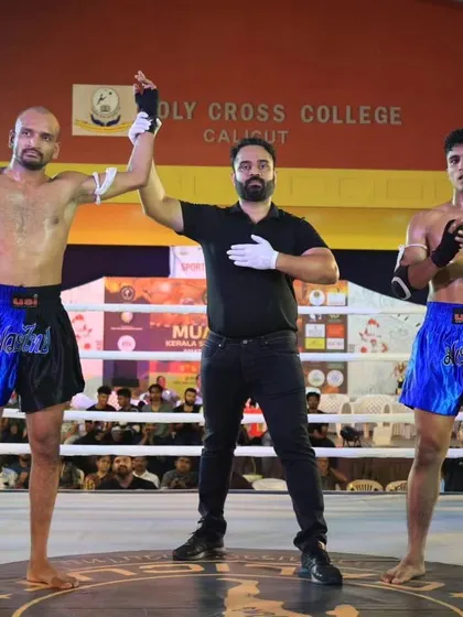 The official decision. Our fighter's hand is raised, a result of superior strategy and execution in the ring.