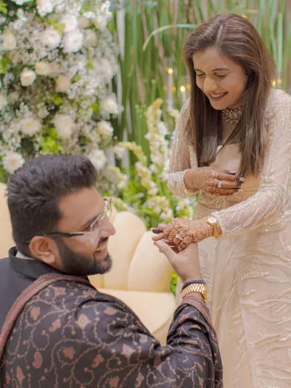 The bride's joyful reaction during a heartfelt proposal moment at their engagement ceremony. Capturing pure, genuine emotion is what we do best.