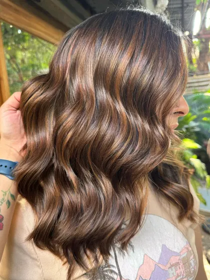 Caramel highlights running through strands like rivers of gold. This non-bleach color is so beautiful and dimensional. (No filter)