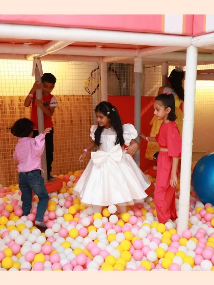 A princess in her castle of balls. The ball pit is a great place for imaginative play and making new friends.