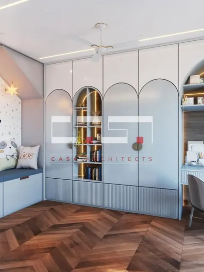 This personalized kids' room features a cozy window seat, custom-built wardrobes with arched details and open shelving for books, and a dedicated study nook.