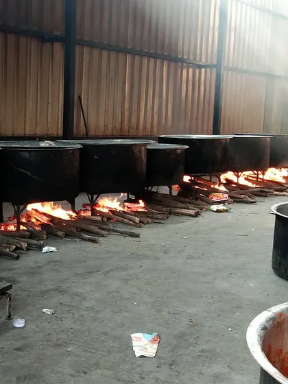 A full view of our outdoor kitchen setup, with a long line of wood-fire stoves ready for a massive cooking session. We can set this up anywhere to serve you fresh.