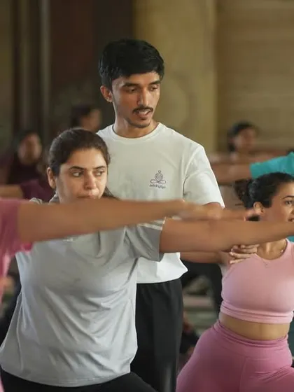 An instructor guides a large group during our Yoga Day celebration. It's a thrill to lead so many enthusiastic students in a shared practice.