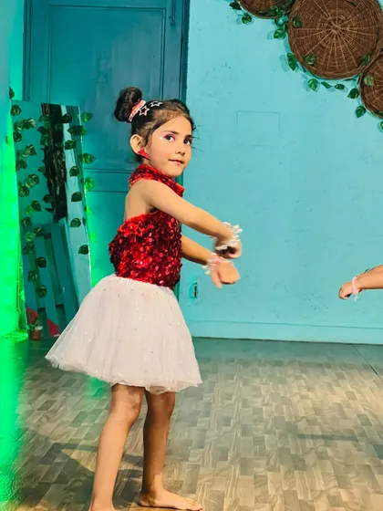 A young performer caught in a moment of graceful movement during our video shoot.