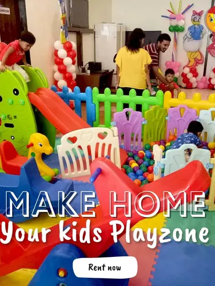 Make your home your kid's favorite playzone. This setup in a living room includes a seesaw, a slide, and a ball pit, proving that you can have a complete and exciting play area without leaving the house.