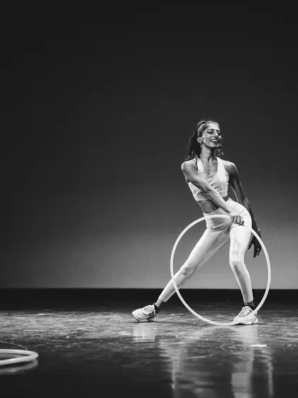 A candid moment of smiles and movement from my first performance. Even when I'm focused on the tricks, the happiness of hooping always shines through.
