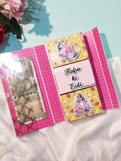 A personalized Eidi envelope with multiple compartments.